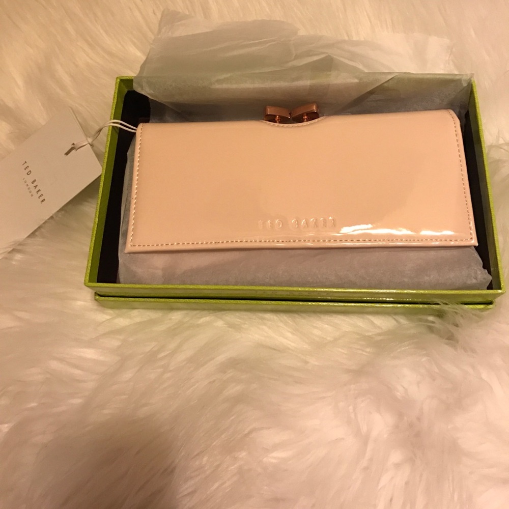 Brand new Ted Baker wallet tags attached.